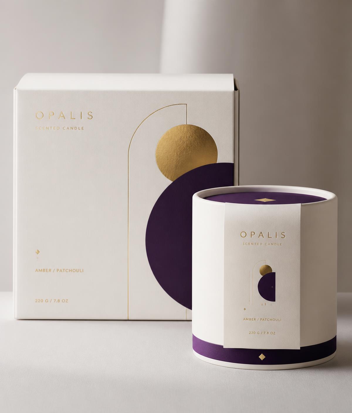 Ivory packaging box and candle vessel with gold foil geometric mark and deep violet detail